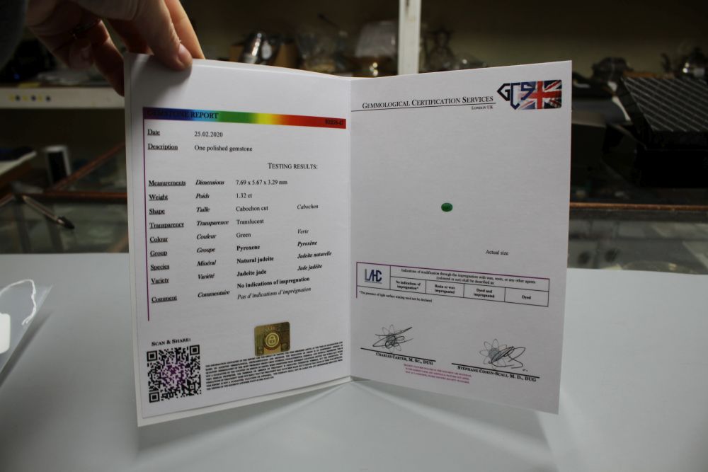 An unmounted cabochon cut jadeite stone, with GCS certificate dated 25/02/20